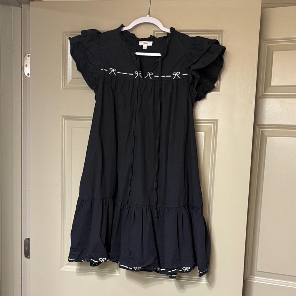 Black Dress with White Bow Accents